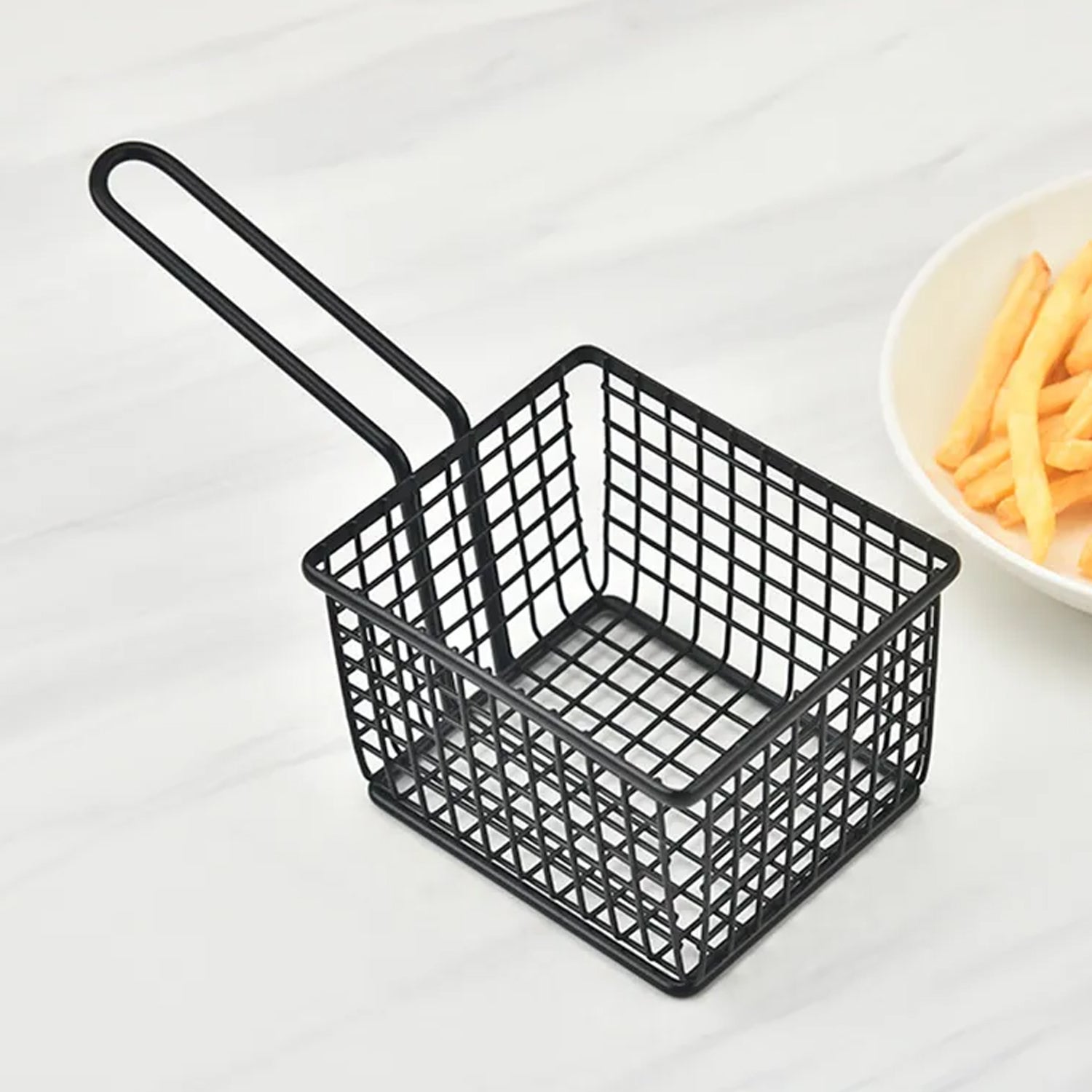 Stainless steel food strainer basket for kitchen use.