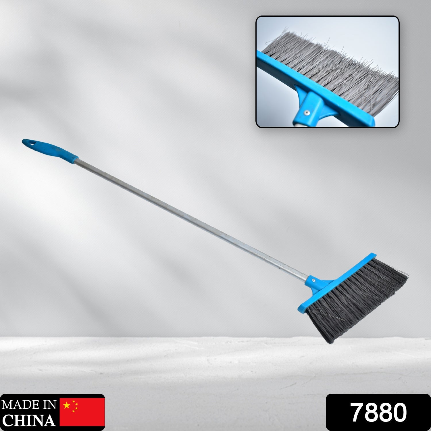 Stiff-bristle scrub brush with long handle, ideal for cleaning bathroom floors and tiles.