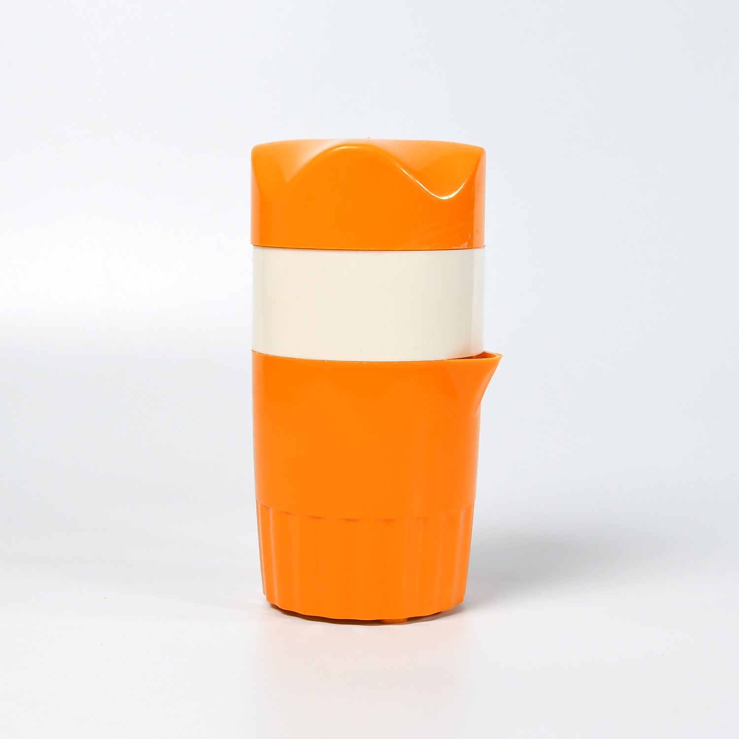 Orange juicer with angled spout