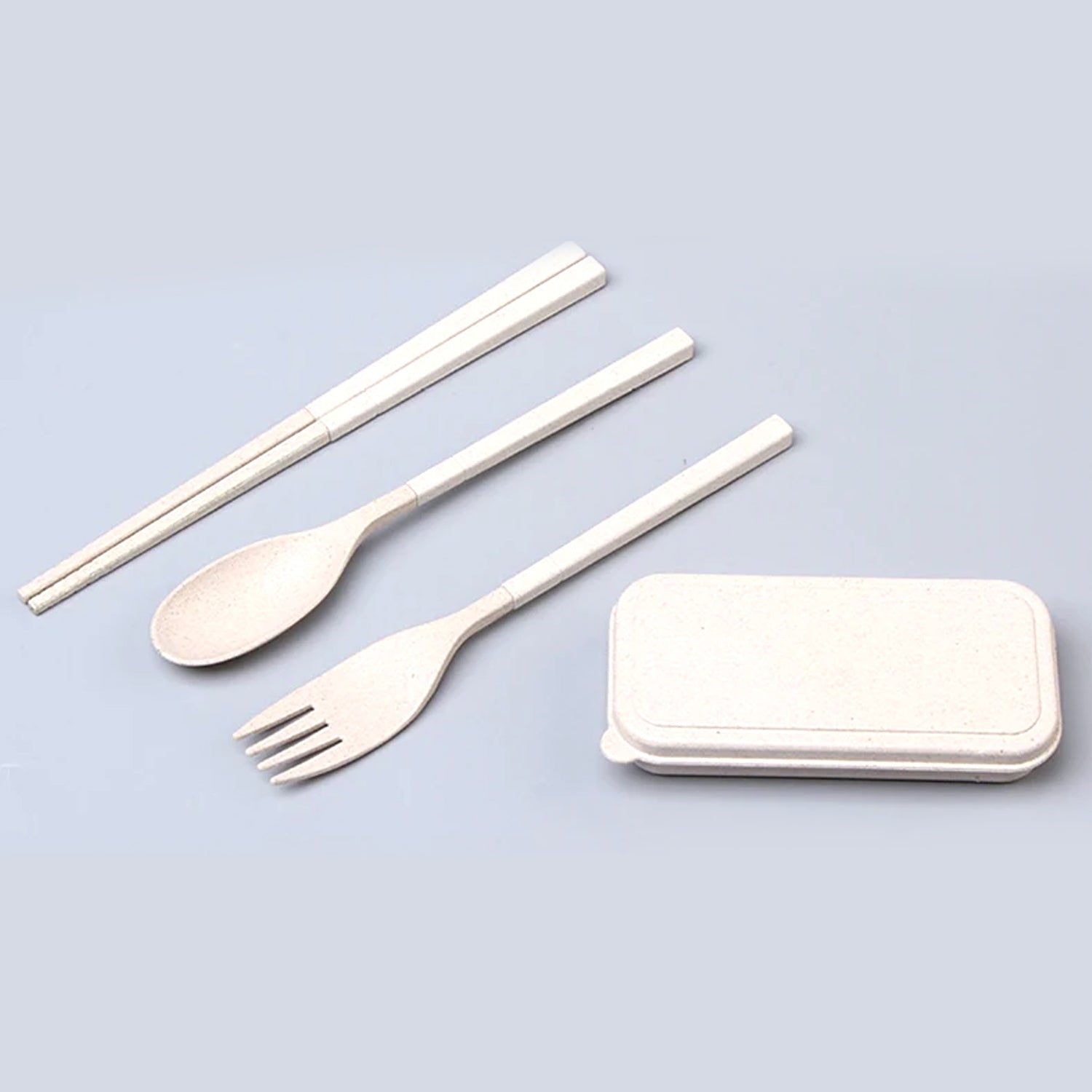 Cutlery set with spoon, fork, and chopsticks.