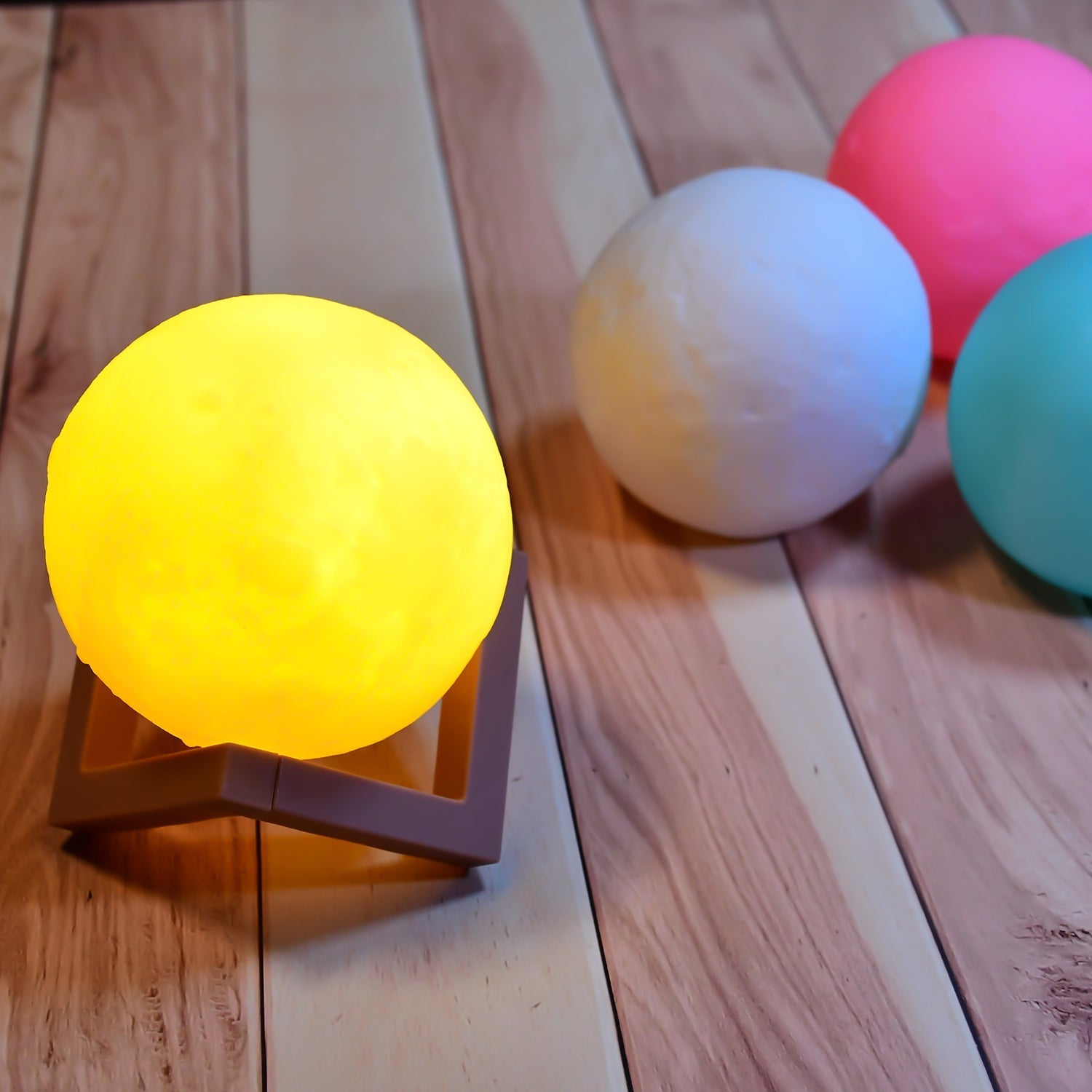 Wooden stand moon night lamp with adjustable brightness settings.