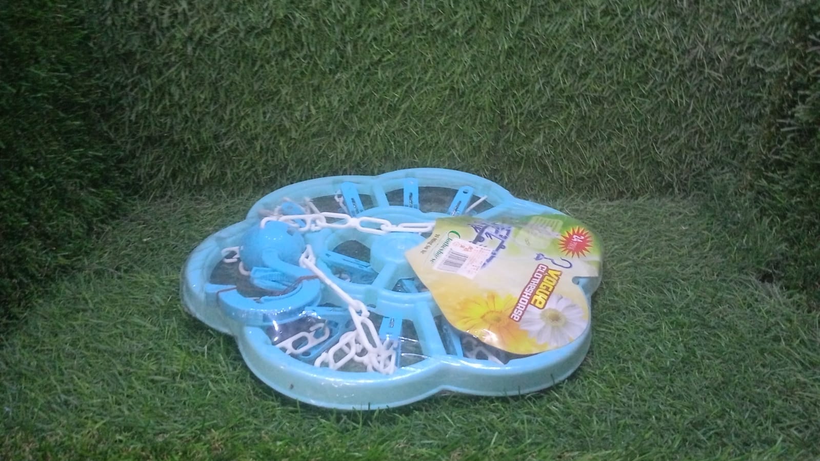 Clothes hanger clips in use, drying clothes outdoors