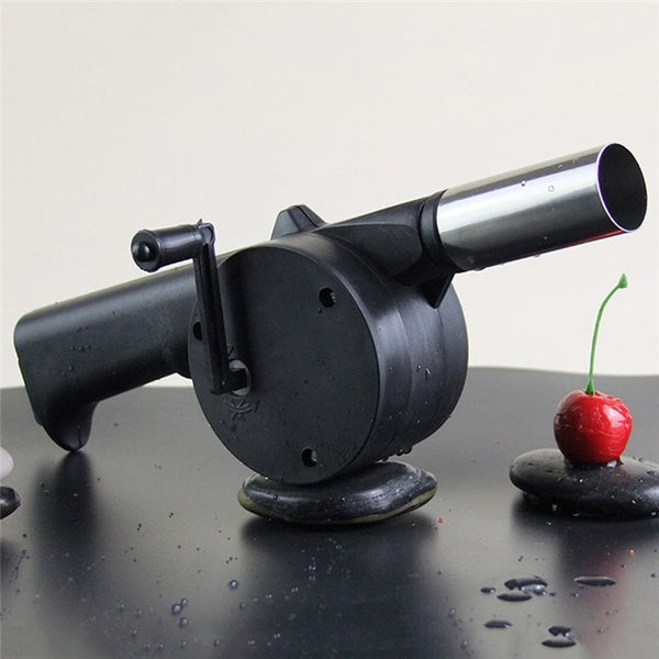 Portable hand crank air blower for charcoal grilling and BBQs.