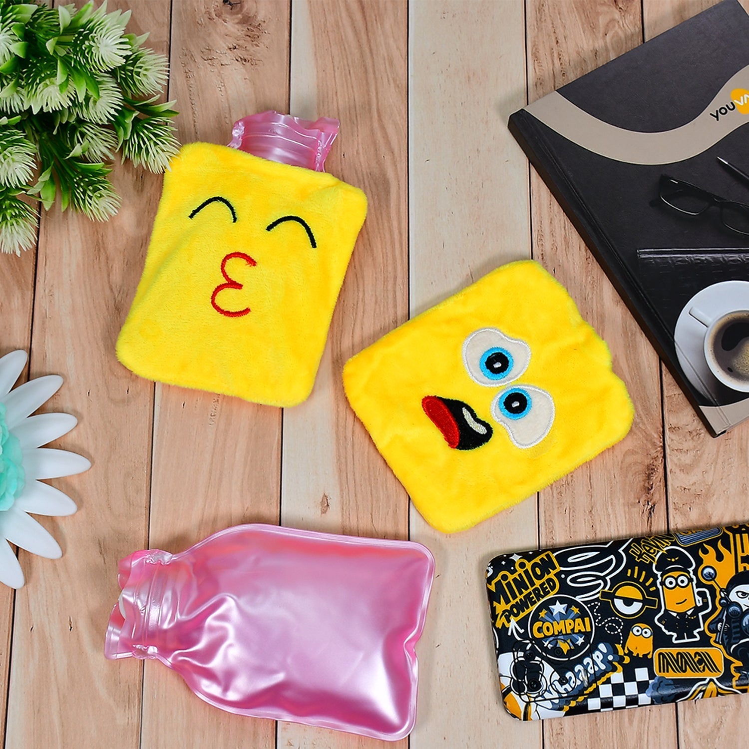 Small hot water bag with emoji print for pain relief.